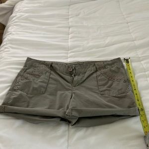 Beige/khaki shorts, with sewing details. Goes best with a graphic tee or tank.